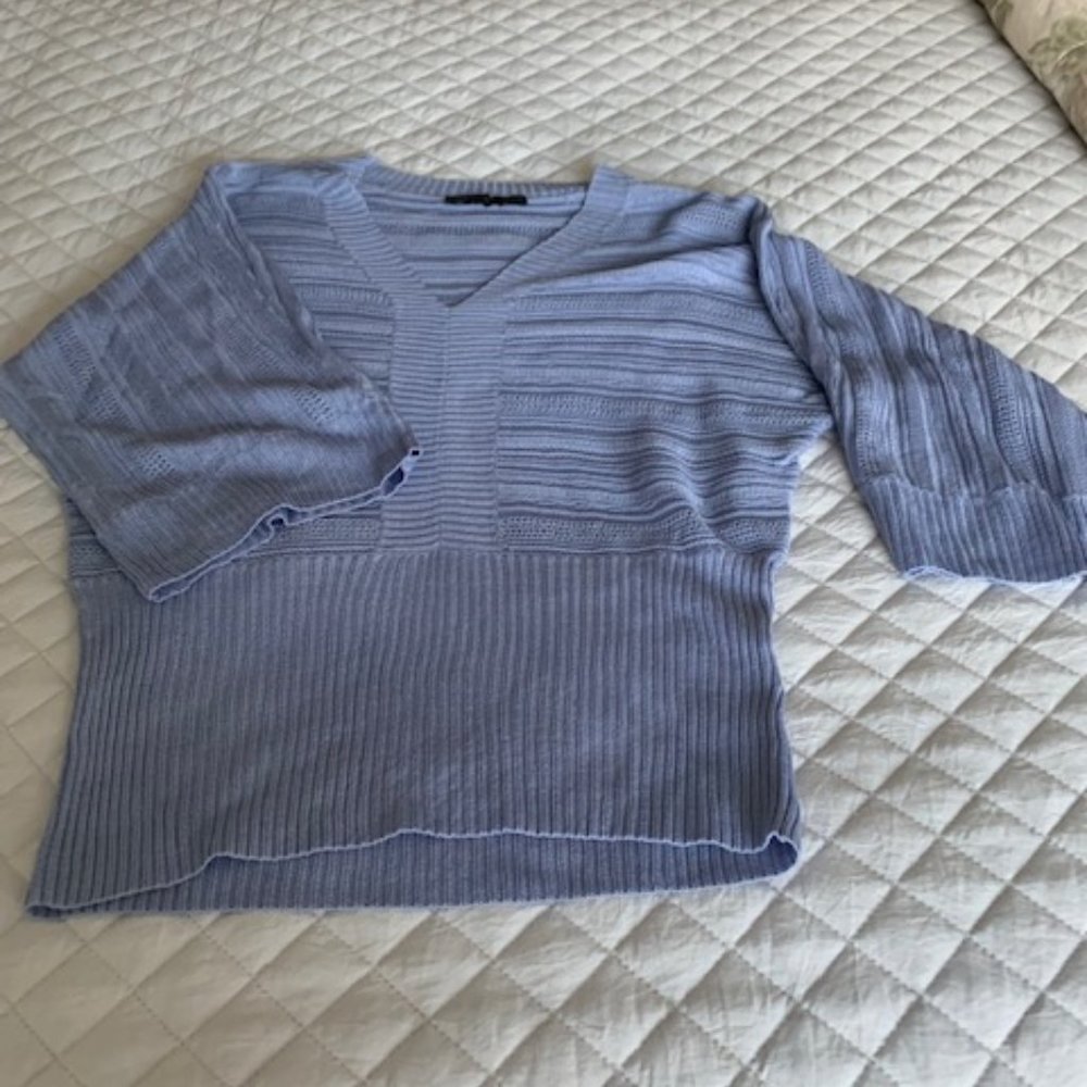 Periwinkle-colored sweater